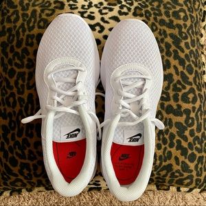 Nike Tanjun athletic shoes.